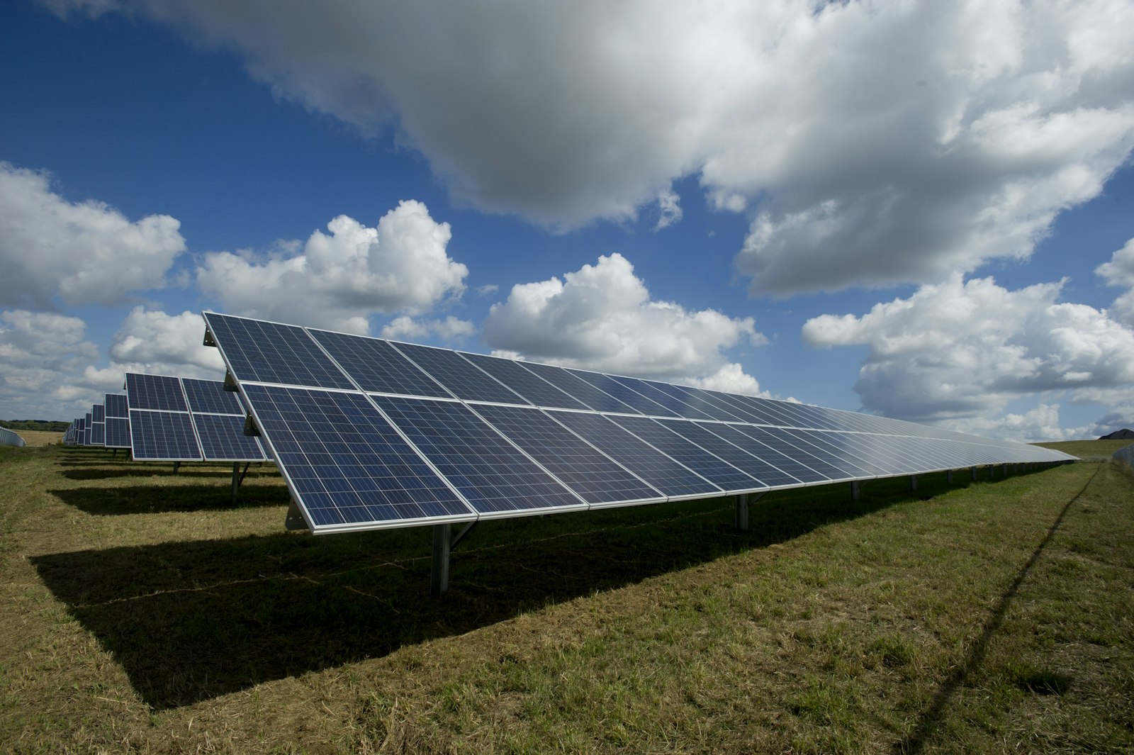 Solar panels and mountains in northern Spain under the sunrise